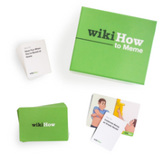 Stack of cards that read 'How To Have Fun When You're Bored at Home,' the wikiHow to Meme Card Game Box, a stack of wikiHow to Meme image cards, and one face-up card depicting a man taking off a shirt and the same man painting, with a card that reads 'How to Celebrate Being an Empty Nester' on top